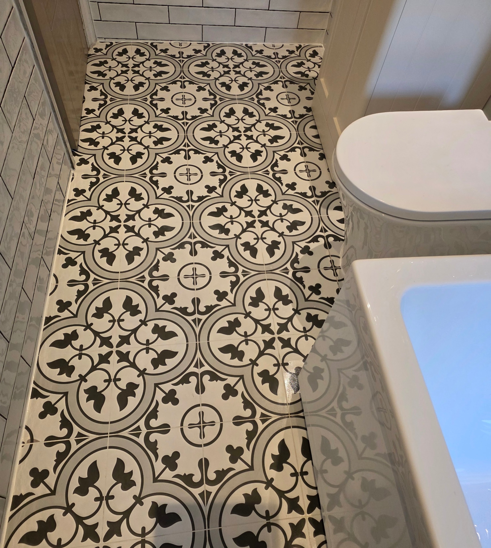 Patterned bathroom floor tiling detail in a Tamworth renovation